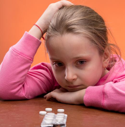 A child psychiatrist may prescribe medication to a child with mental health issues.