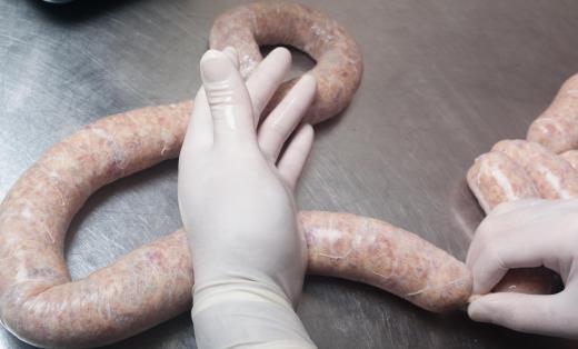 Some sausages are hand-stuffed by trained butchers.