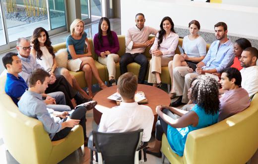 Project coordinators often lead meetings with all members of the team.