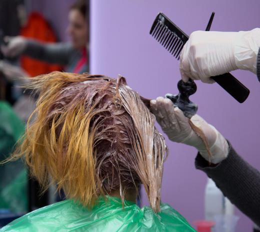 A professional hair stylist may dye a customer's hair.