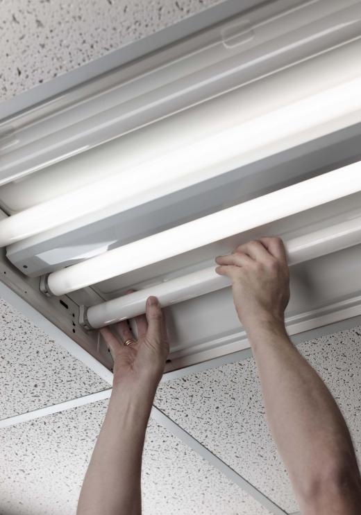 A maintenance electrician may replace fluorescent lights.