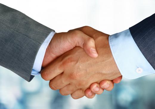 A good way to introduce oneself for an interview is with a confident smile and handshake.