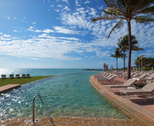 A cabana boy may keep the pool and pool area clean from debris.