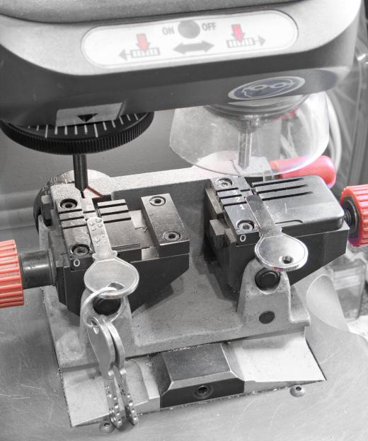 A master locksmith may use a laser key cutting machine to make keys.