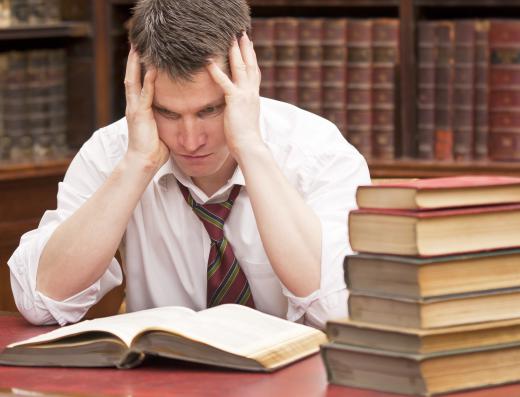 Man studying at a library.