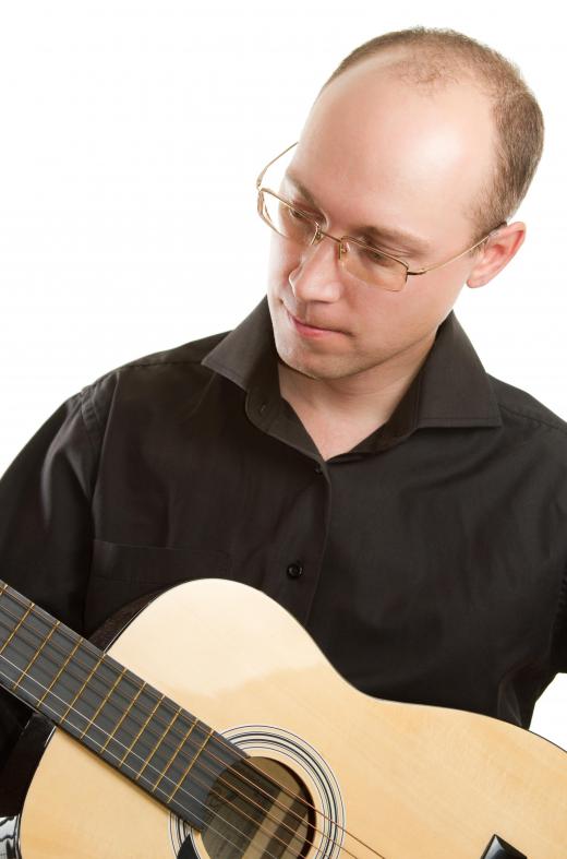 A music arranger might take music written for a piano and convert it so a guitarist can play it.