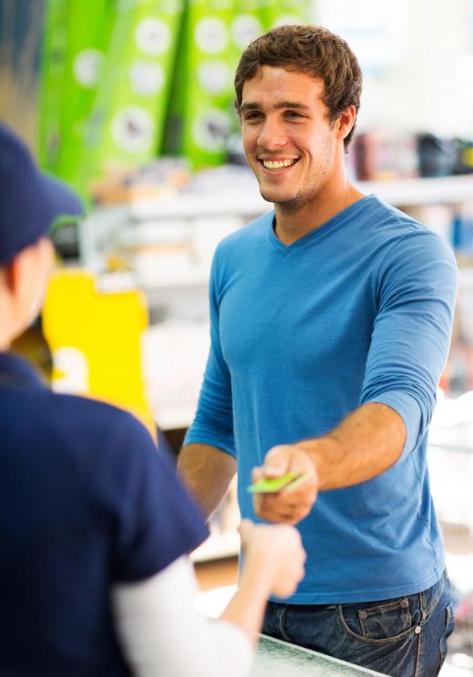 The duties of a supermarket cashier often include running a cash register and answering shoppers' questions.