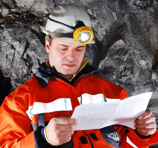 A mining trainee is getting on-the-job experience working in mines.