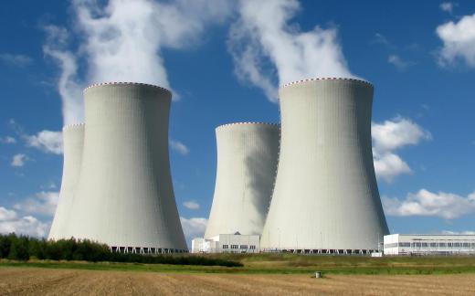 A nuclear power plant uses fission to heat water into steam that, in turn, drives turbines that generate electricity.