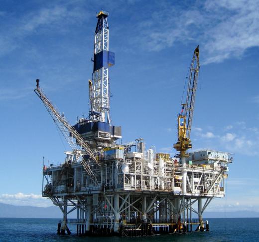 A derrickhand works on an oil drilling platform.