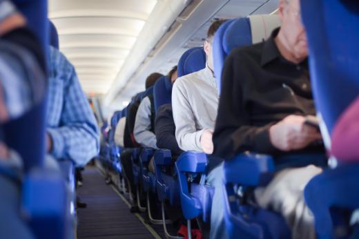 A gate agent works for an airline, checking in passengers and ensuring that the boarding process runs smoothly.