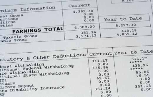 An accounting coordinator gathers all pertinent paperwork to be filed, including pay stubs.