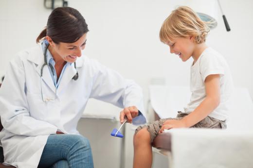 A developmental pediatrician may check a child's reflexes.