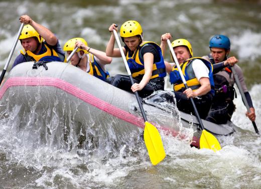 An adventure tour guide may lead clients on a rafting trip.