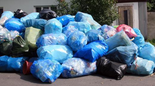 Street sweepers work to remove garbage from roads and curbs.