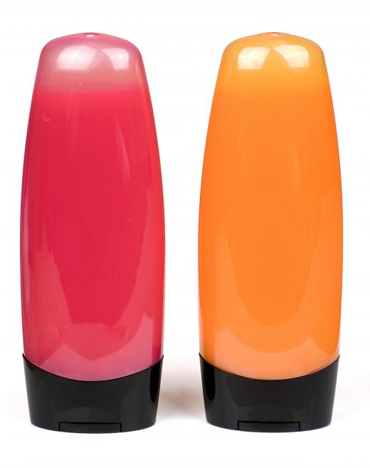 Bottles of pink and orange body wash.