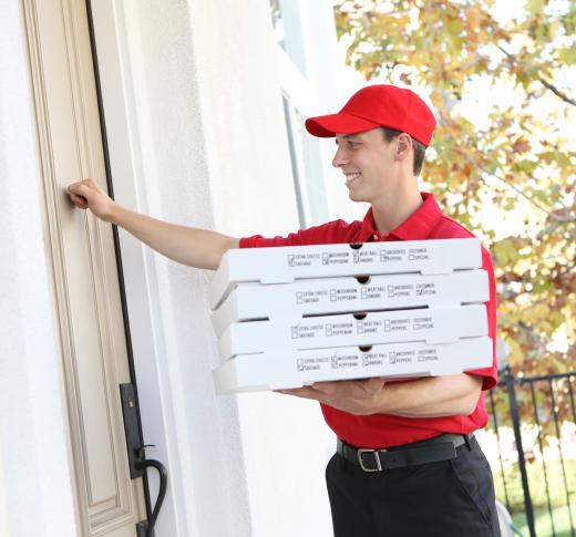 A man delivers pizza from a local pizzeria.