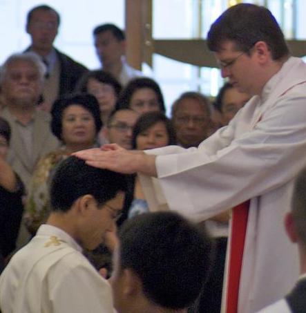 A priest being ordained.