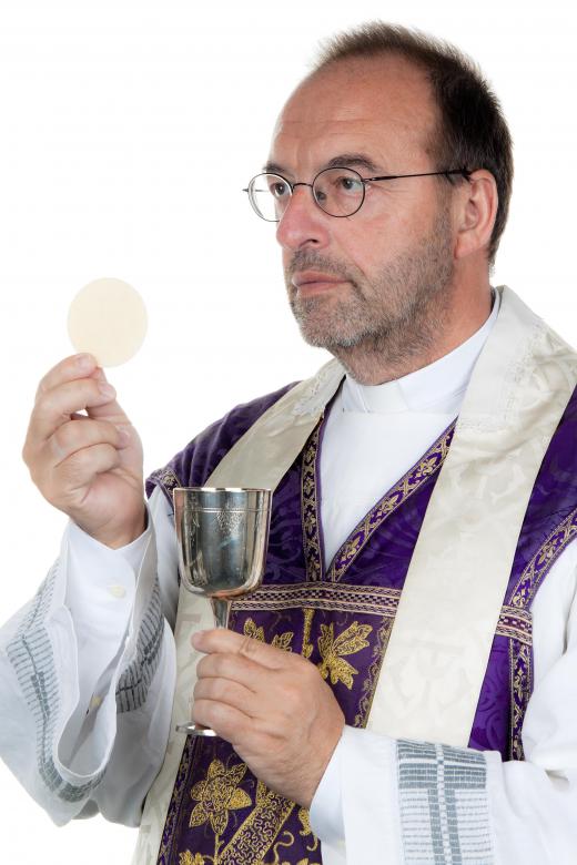 In the Roman Catholic tradition, a priest converts bread and water into the body and blood of Christ as part of the sacrament of communion.