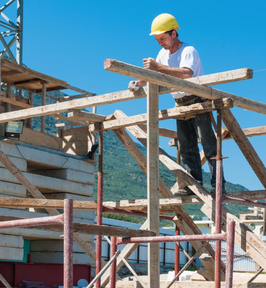 Scaffolds can be constructed of metal pipes or wood.