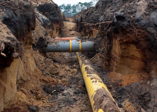 Sewage travels through sewer lines to a treatment facility.