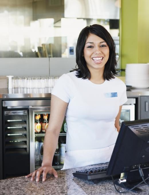 At a small cafe or restaurant, a waitress may not only serve customers but also operate the cash register.