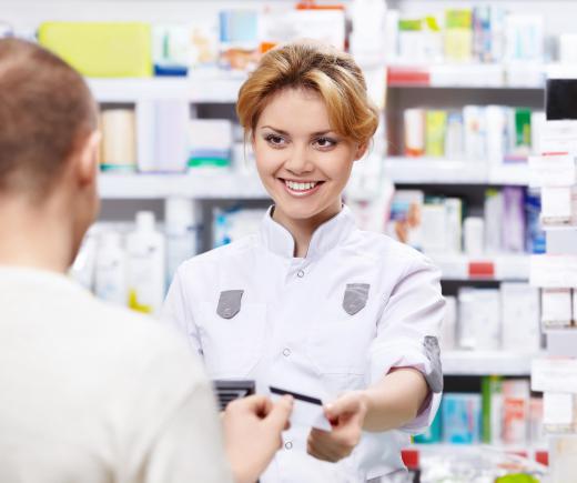 An infusion pharmacist prepares medicine for infusion via intravenous routes.