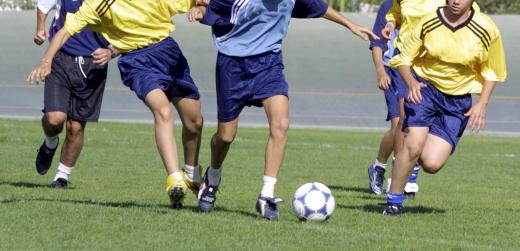 A recreation specialist encourages the participation in athletic activities.