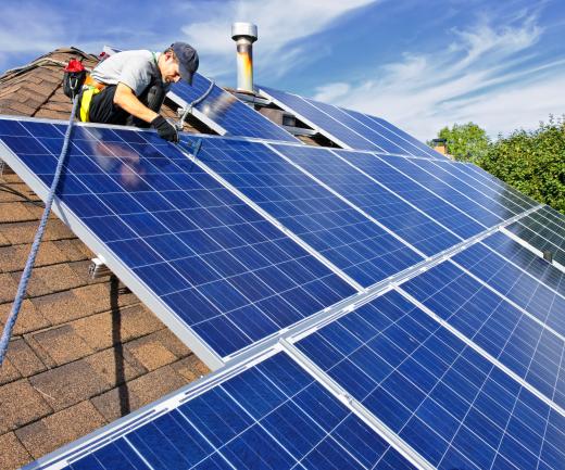 Solar panels are installed on rooftops to create clean energy by converting the sun's ultraviolet rays into electricity.