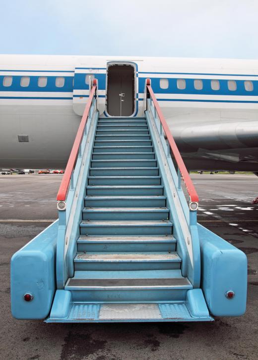 Tarmac and ramp handlers place ensure that boarding equipment is ready for incoming commercial flights.