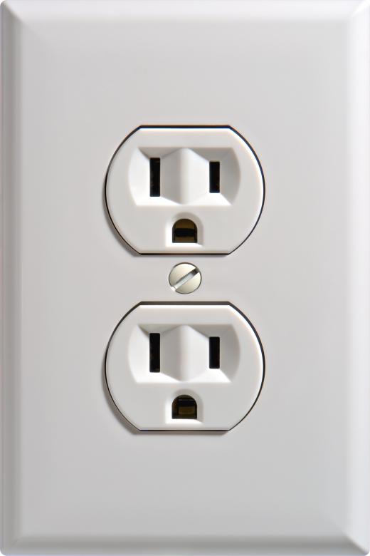 Electricians wire and test power outlets.