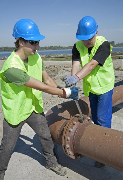 Corrosion technicians inspect and repair metal pipelines.