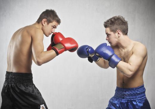 A boxing referee is responsible for officiating a match.