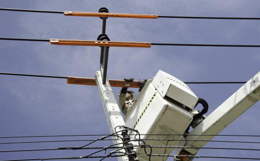 Cable technicians must sometimes use bucket trucks to work on the lines.