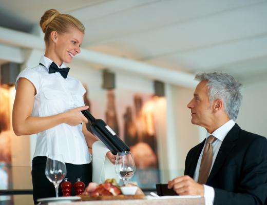 A waitress serving a customer.