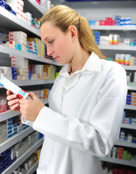 Trainee dispensers may be in charge of cross checking dispensed drugs with prescription details.