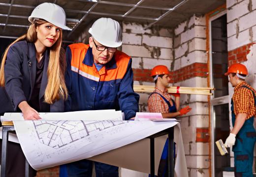 Residential builders coordinate the construction site.