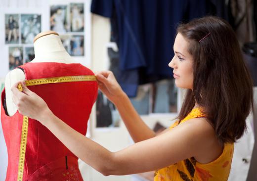 Dressmaking schools can teach students basic skills, like how to properly drape a fabric over a dressmaking dummy.