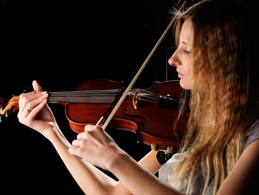 A music conductor may give musicians pointer on how to improve performances.