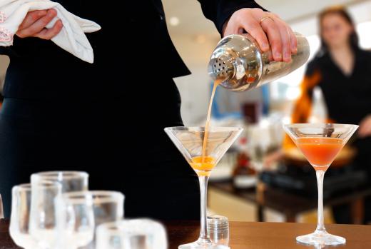 A cocktail server takes drink orders and delivers the drinks to guests.