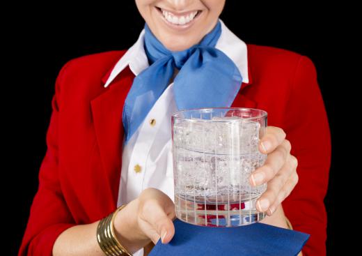 During flights, air hostesses tend to passenger needs and safety.