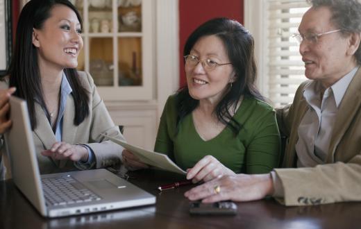 An underwriter trainee is taught how to work with clients in the insurance industry.