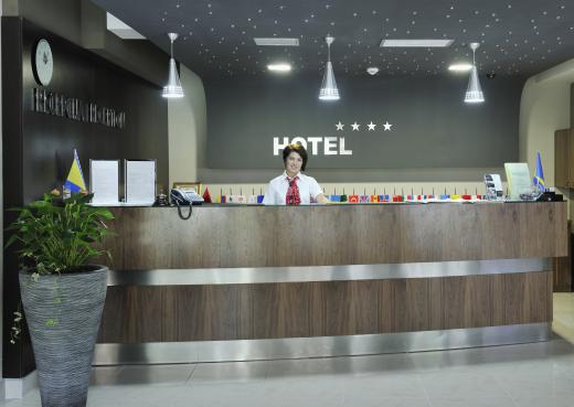 A night auditor at a hotel will likely be in charge of guest services at night, which includes checking in late arrivals.